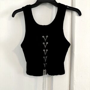 Chained midriff tank top. 89% Rayon. 11% Spandex. Chain is adjustable.